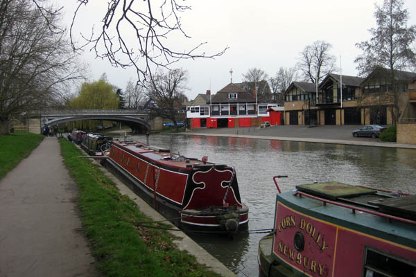 Narrowboats and rowing clubs on the River Cam in Cambridge, England